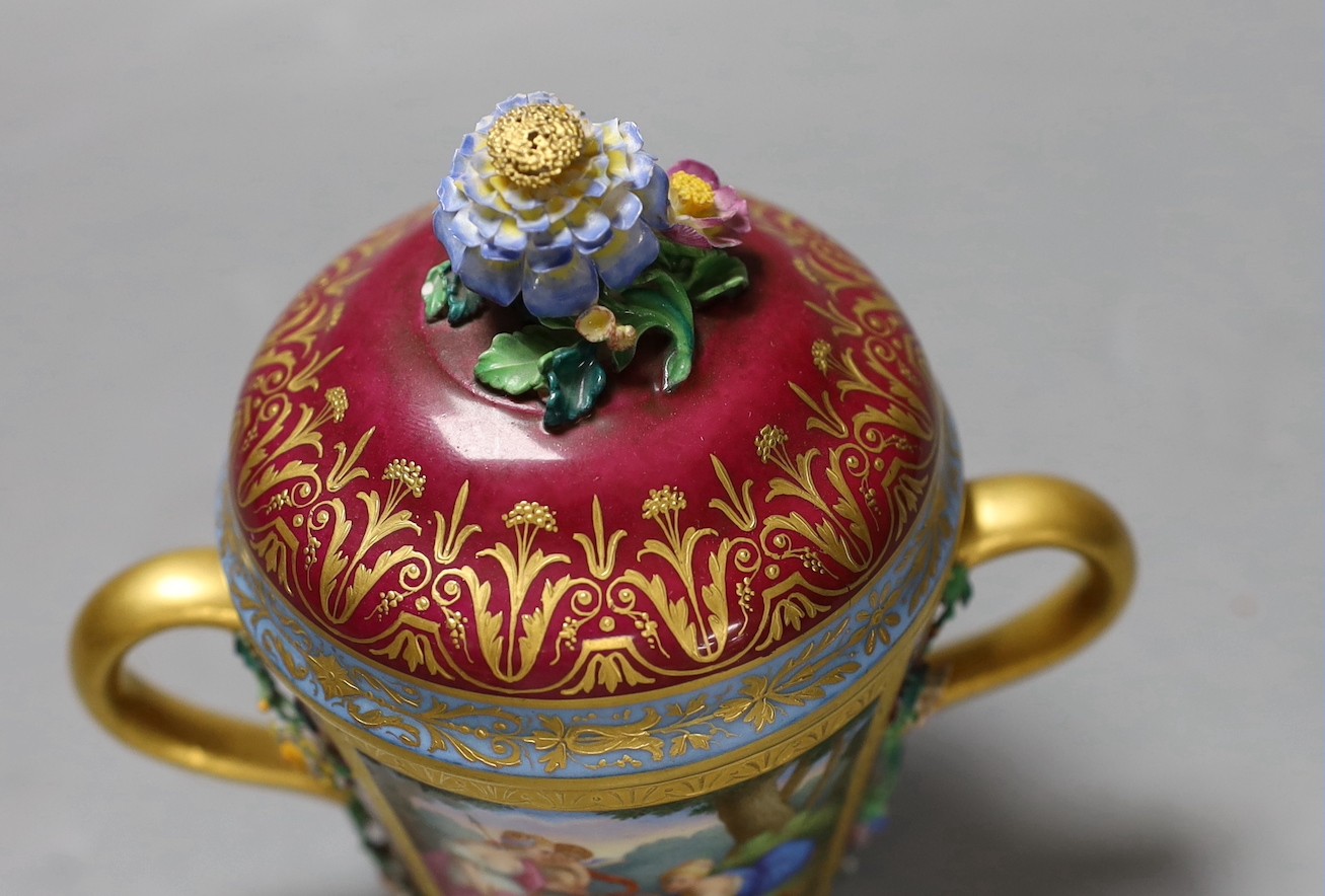 A Vienna style two handled porcelain chocolate cup and cover, c.1900, 13cms high